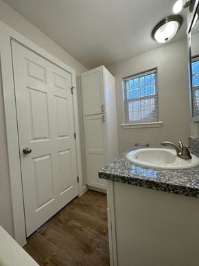 El Campo apartment for rent - a bathroom with a sink and a white door