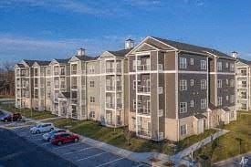 Winchester apartment for rent - a row of apartment buildings next to a parking lot