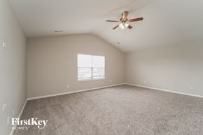 Charlotte house for rent - a bedroom with carpet and a ceiling fan