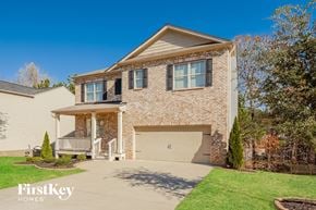 Dallas house for rent - A house with a garage and a porch is for sale.