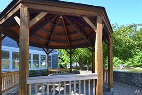 Saint Louis apartment for rent - a wooden gazebo with a table and chairs on it