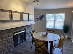 Saint Louis apartment for rent - a dining room with a table and a fireplace