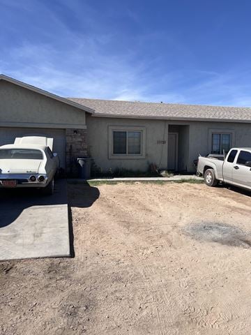 Buckeye house for rent - a house with two cars parked in front of it