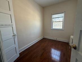 Cranford apartment for rent - A room with a white door and a window with blinds.