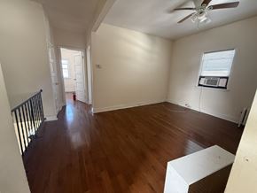 Cranford apartment for rent - A room with wooden floors and a ceiling fan.
