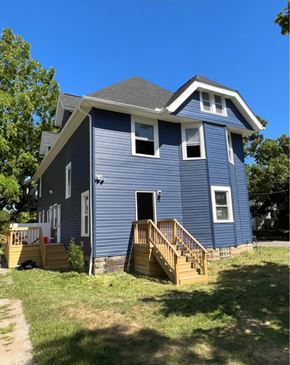 Akron house for rent - A blue house with a white trim and a small porch.