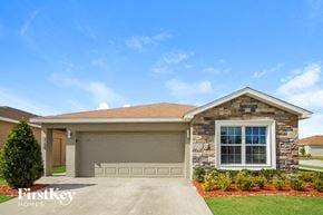 Winter Haven house for rent - a house with a driveway and a garage door