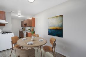 Sterling Heights apartment for rent - A dining room with a round table and chairs.