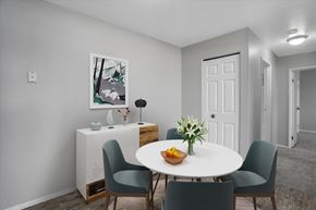 Sterling Heights apartment for rent - A dining room with a white table and chairs.