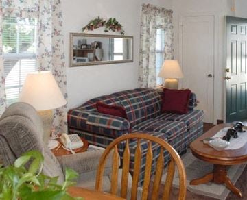 Springfield triplex for rent - a living room with a couch and a table