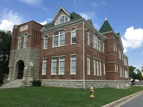 Little Rock apartment for rent - a brick building with a yellow fire hydrant in front of it