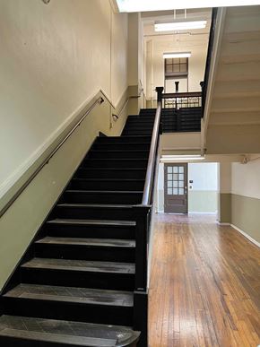Little Rock apartment for rent - the stairs to the second floor of the building are empty