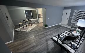 Saline apartment for rent - A living room with a black and white striped couch.