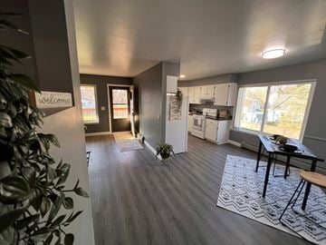 Saline apartment for rent - A living room with a dining table and chairs.