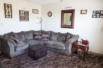 Webb City apartment for rent - a living room with a couch and a table