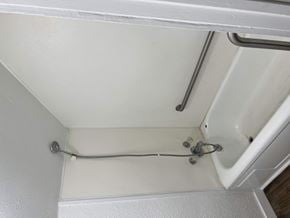 Abilene apartment for rent - A white shower curtain rod is mounted on a white wall.