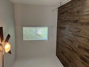 Abilene apartment for rent - A room with a ceiling fan and a window.