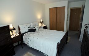 Torrington apartment for rent - a bedroom with a bed and two dressers and a closet