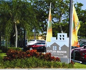 Miami apartment for rent - a sign for the culver manor hotel in front of a parking lot