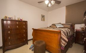 Miami apartment for rent - a bedroom with a bed and a dresser