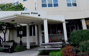 Excelsior Springs apartment for rent - the front of the colony plaza building with two benches