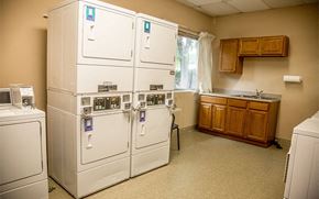Excelsior Springs apartment for rent - a kitchen with two refrigerators and a sink and a window