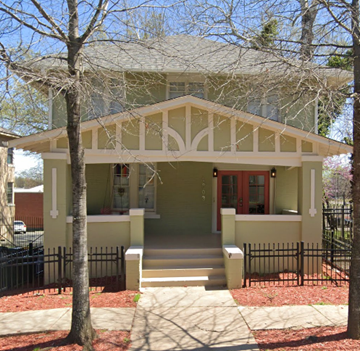 Little Rock apartment for rent - the front of a yellow house with a porch