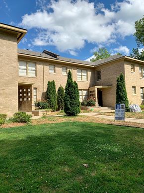 Little Rock apartment for rent - a large brick house with a yard in front of it