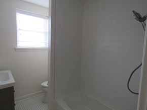 Little Rock apartment for rent - a small bathroom with a shower and a toilet