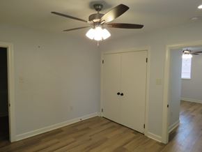 Little Rock apartment for rent - a bedroom with a ceiling fan and a closet