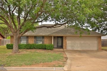 Abilene house for rent - A house with a tree in front of it.
