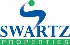 Decatur house for rent - A blue and green logo for Swartz Properties.