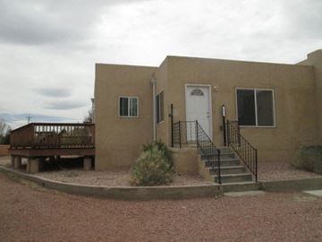 Gallup apartment for rent - A house with a white door and a balcony.