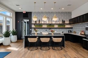 Independence apartment for rent - a kitchen with a large island with four chairs