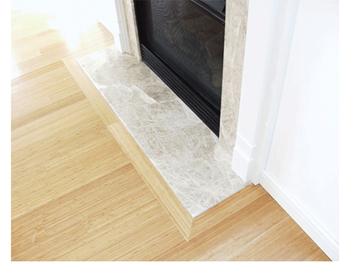 Gas fireplace with marble facing and hearth with painted wood mantel