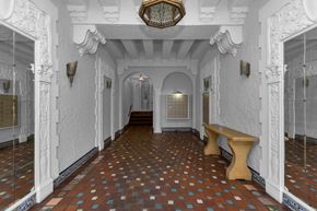 San Francisco apartment for rent - A hallway with white walls and a tiled floor.