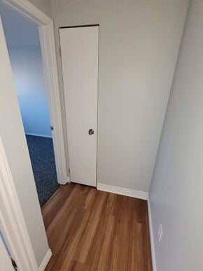 Waterloo apartment for rent - a bedroom with a closet and a hard wood floor
