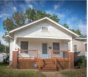 Saint Louis house for rent - a white house with a porch and a blue sky
