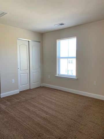 Laurel apartment for rent - a living room with a window and a carpet