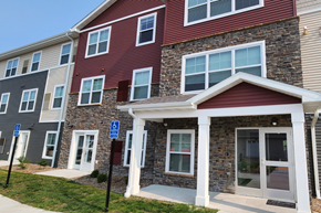 Moorhead apartment for rent - a building with brick and stone exterior and a porch