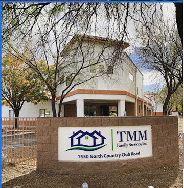 Tucson apartment for rent - A sign for TMM Family Services, Inc. in front of a building.