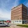 Council Bluffs apartment for rent - a tall brick building on the side of a street