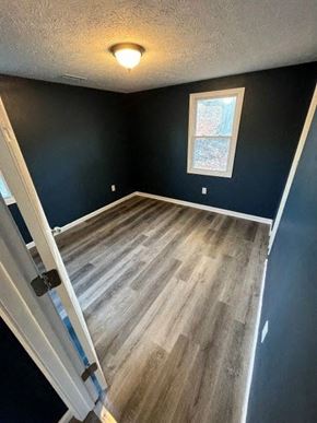 Medina house for rent - A room with a window and wooden flooring.