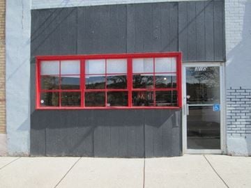 Gallup apartment for rent - A red window on a grey building.