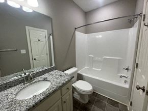 Wilson apartment for rent - a bathroom with a sink toilet and a shower