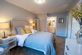 Virginia Beach apartment for rent - a bedroom with a large bed and a bathroom