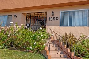 Los Angeles apartment for rent - the front of a building with stairs and a door