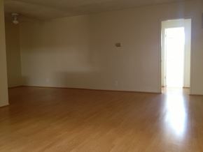 Los Angeles apartment for rent - an empty living room with wooden floors and white walls