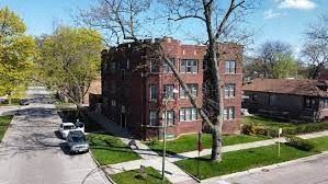 Chicago apartment for rent - an aerial view of a red brick building on a street