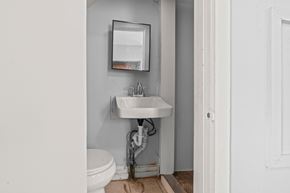 Philadelphia apartment for rent - A white sink is under a mirror in a bathroom.